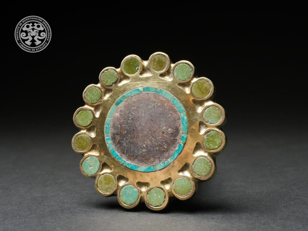 Gold ear ornament with stone inlays