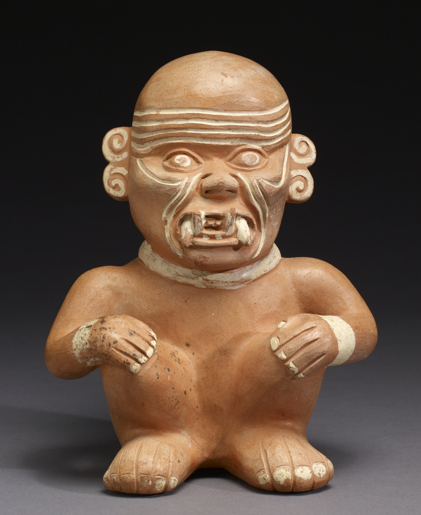 Moche stirrup vessel showing a seated captive