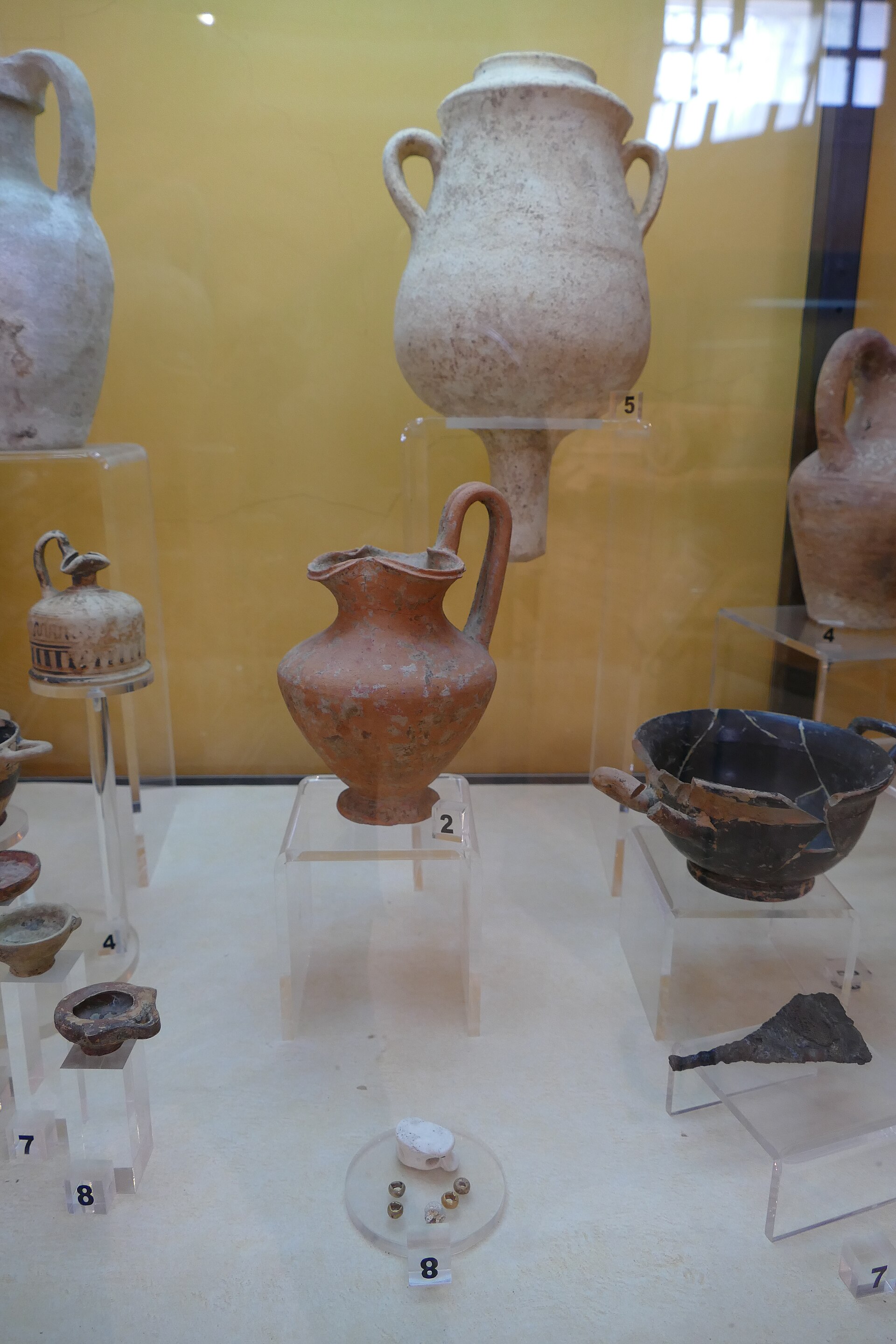 Ancient pottery grave goods on museum display