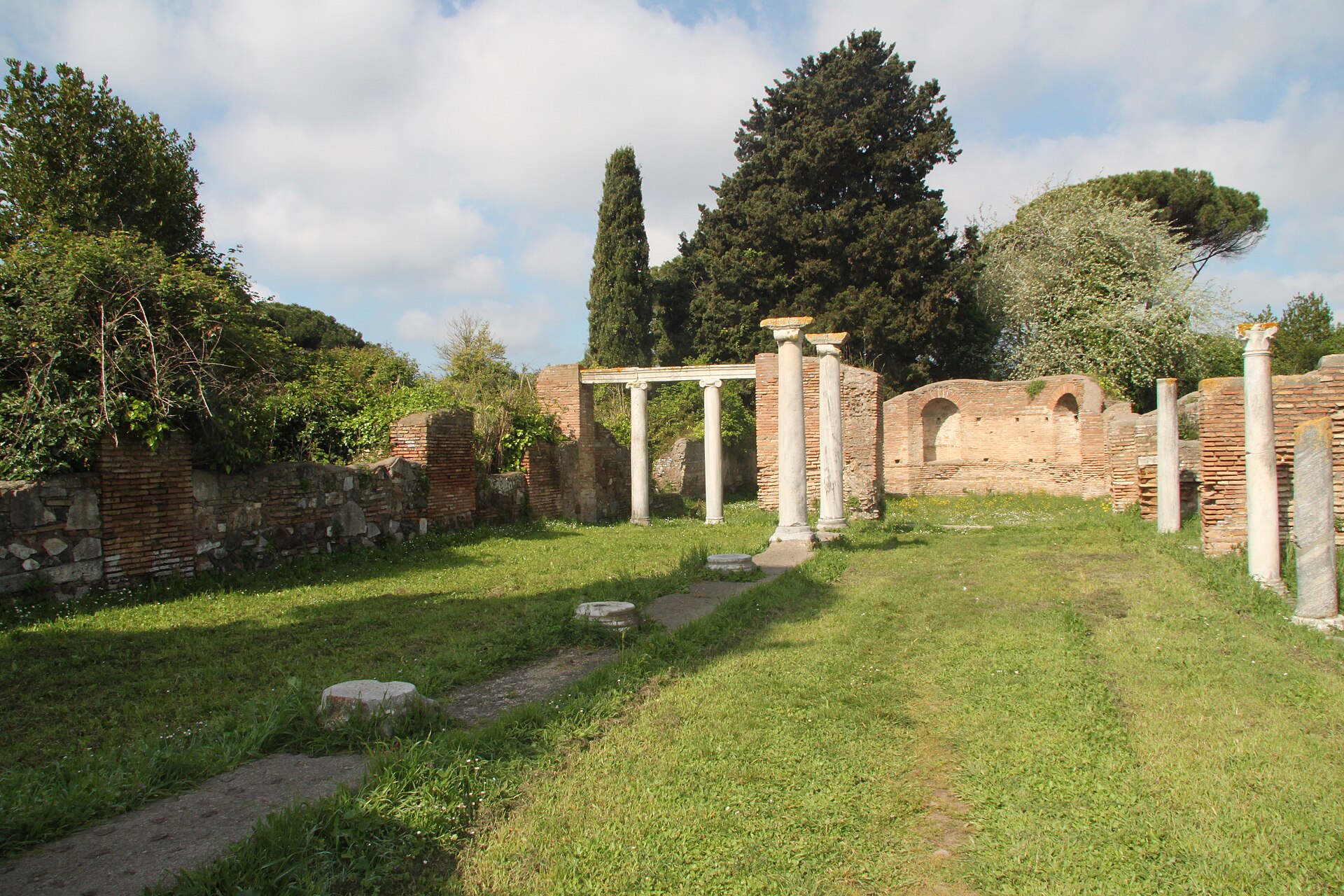 Low brick walls and foundations of an ancient Christian basilica among the ruins of Ostia Antica