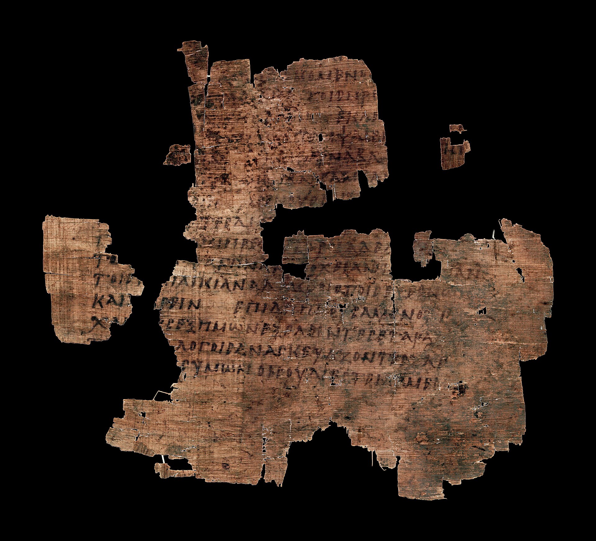 Damaged papyrus fragment with Greek text
