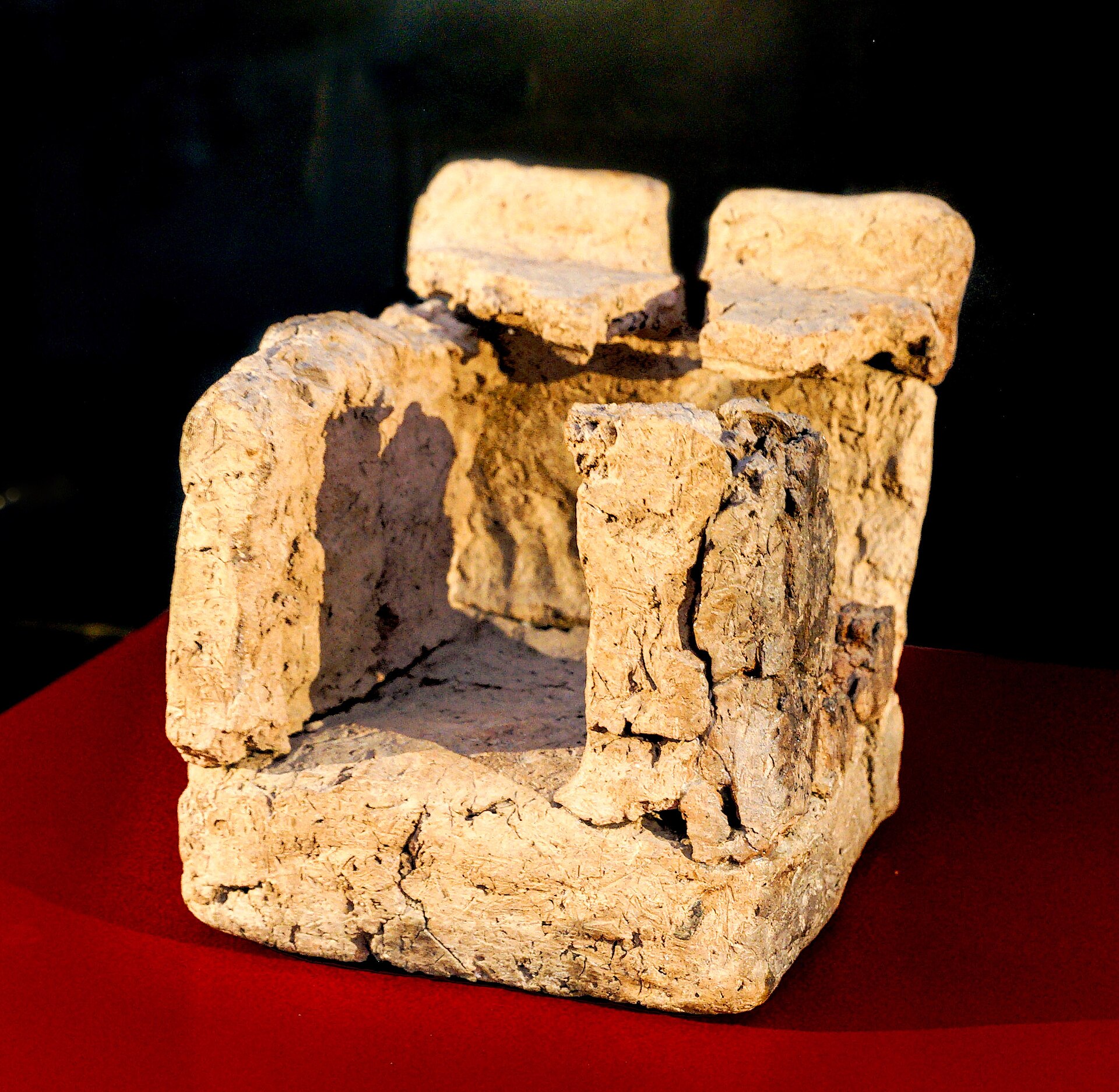 Clay model of a Neolithic house in a museum case