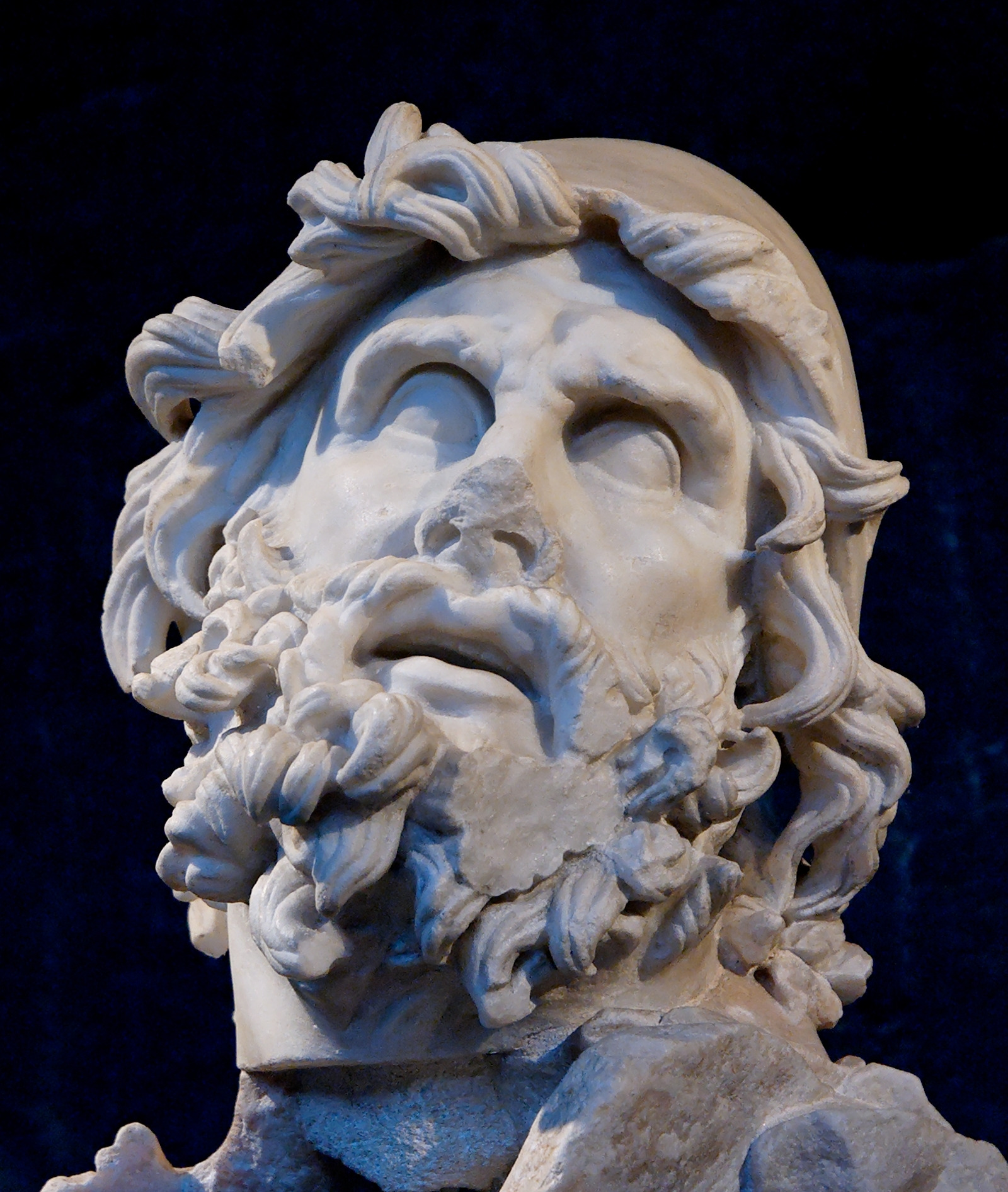Marble head of bearded Odysseus wearing a cap