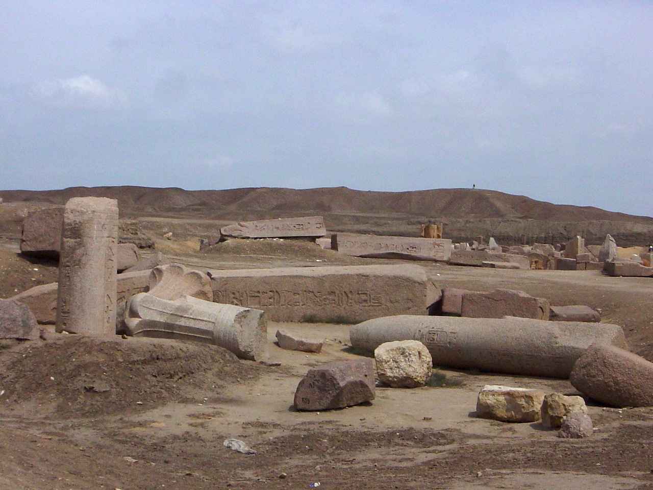 Scattered stone blocks and ruins at the ancient site of Tanis, Egypt