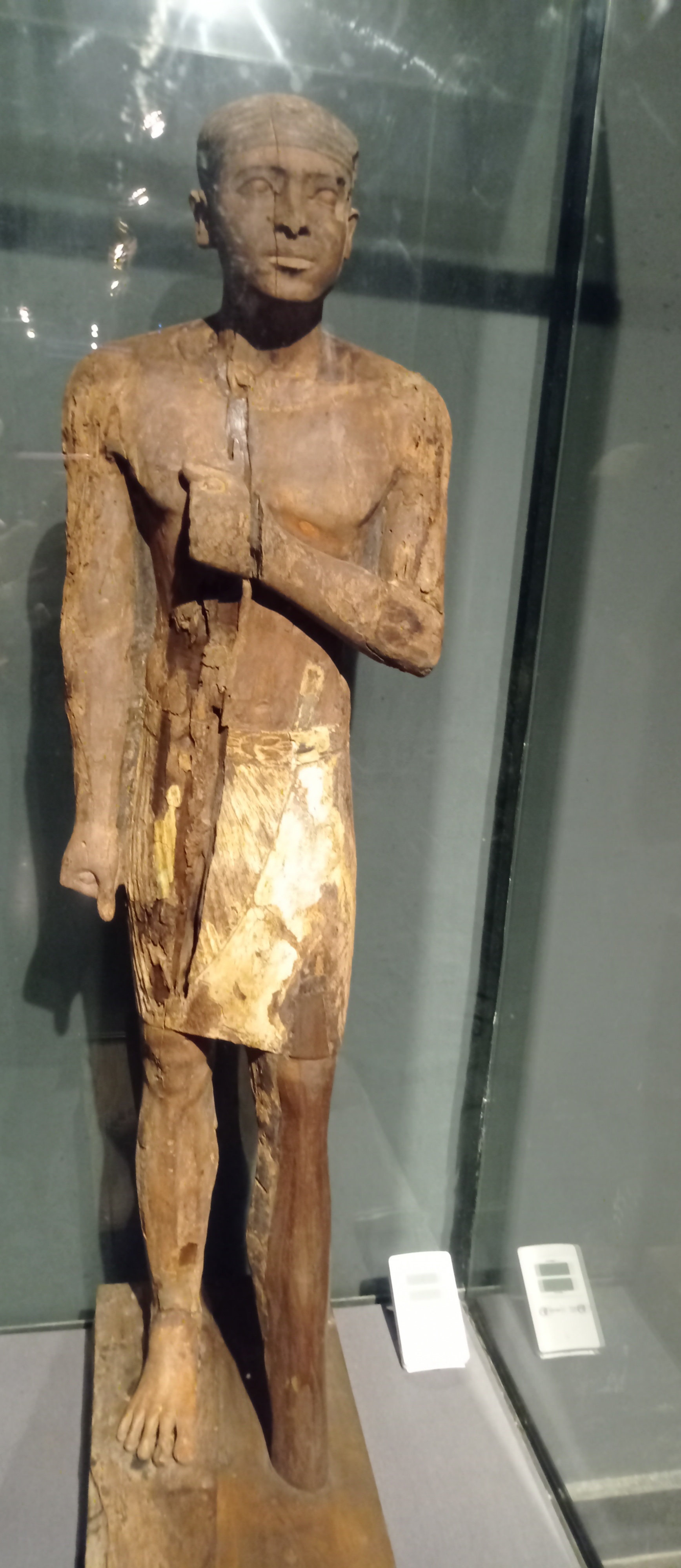 Ancient Egyptian wooden statue of a standing man